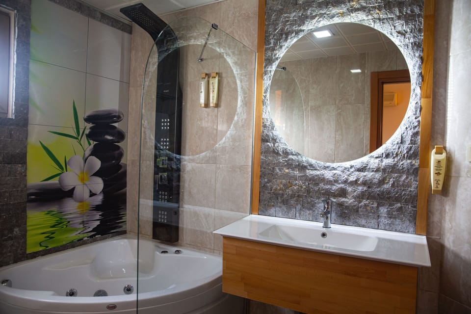 Shower, free toiletries, hair dryer, slippers