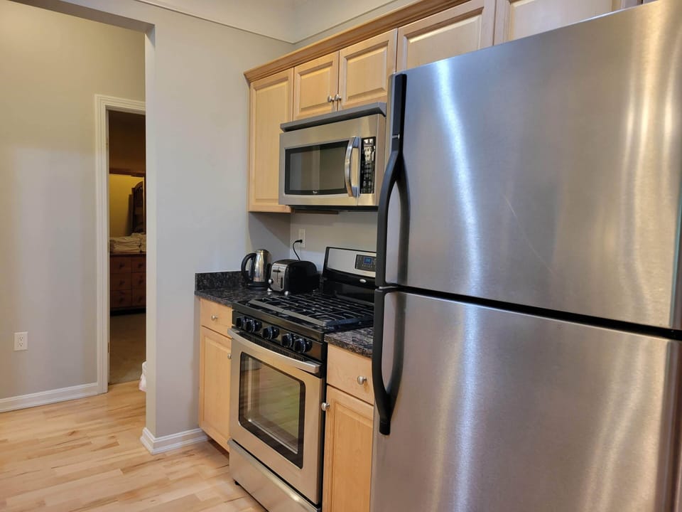 Kitchen workspace with bunkroom beyond