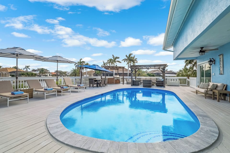 View of Pool, Chaise Lounges, Umbrellas, BBQ and Pergola