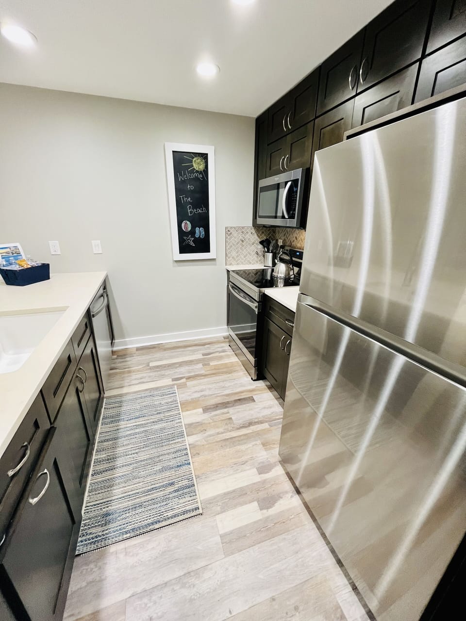 New Lighting and Luxury Vinyl Flooring Throughout Entire Villa. 