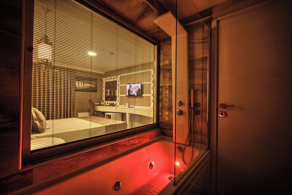 Executive Penthouse, Terrace (Jacuzzi) | Bathroom | Hair dryer, slippers, towels