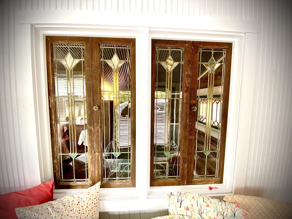 Antique Window Accents above Twin Bed