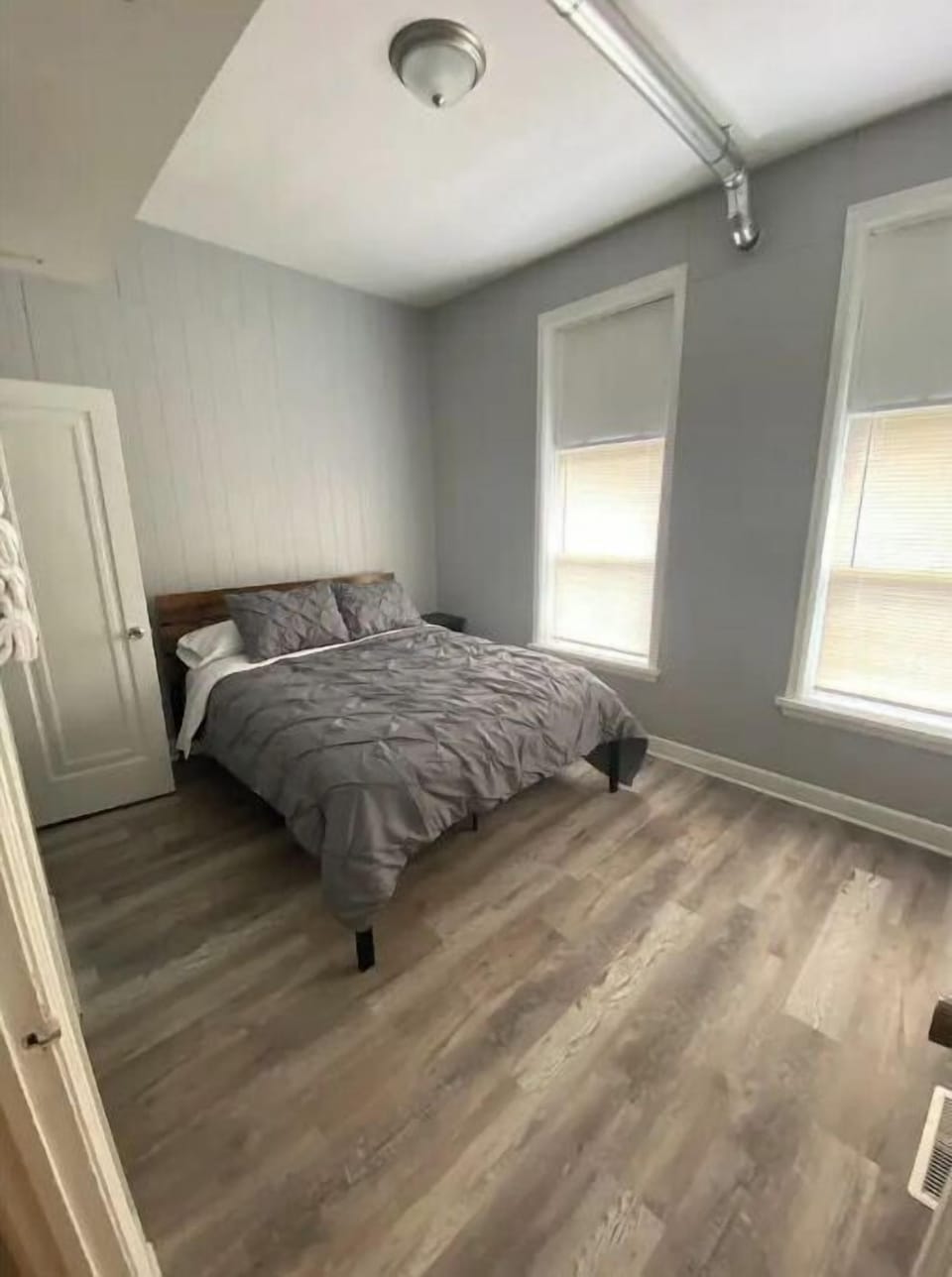 Queen size bed with 2 windows for light and fresh air.