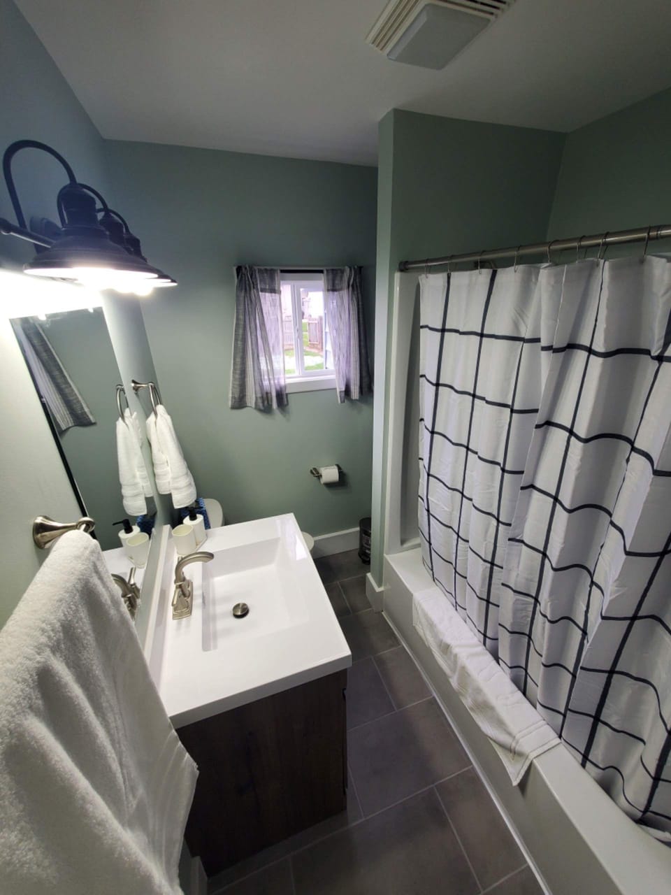 Bathroom on first floor located outside 2 bedrooms.  