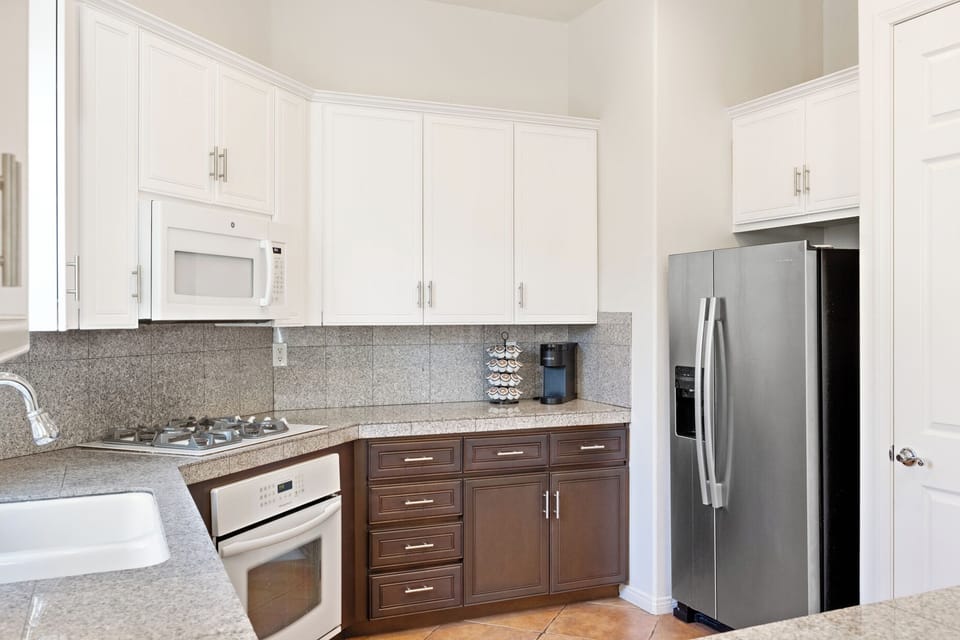 Stainless fridge stocked with snacks means you're always ready for pool days.