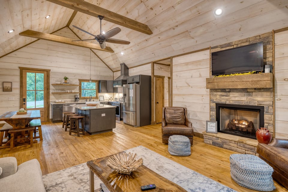 View of kitchen from living room and gas fireplace