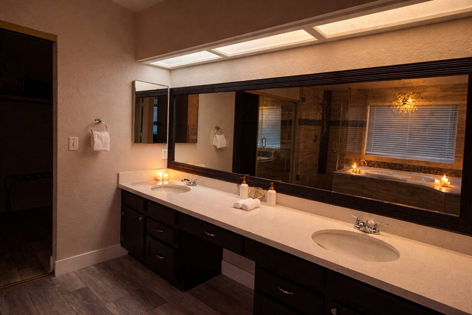 Spa-like bath with double vanity, soaking tub & warm ambiance