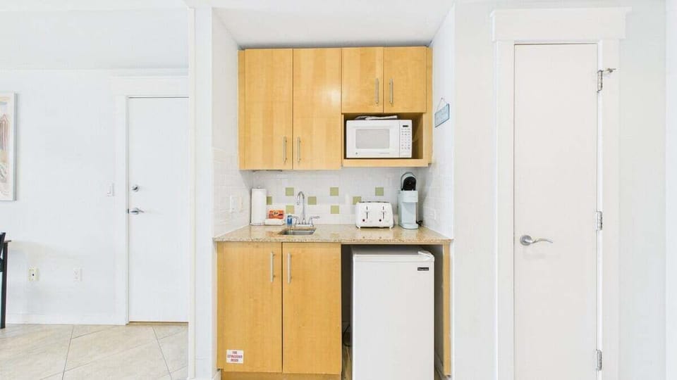 Fully stocked kitchenette with coffee essentials