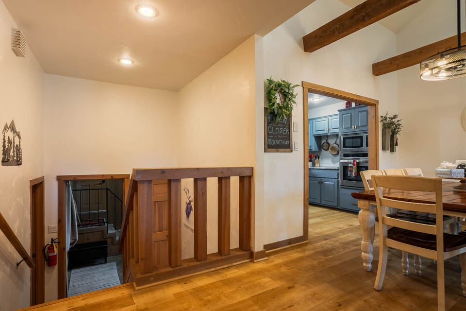 The house is situated across multiple floors. The stairs bring you up from the entry to the living and dinning space, or down to the bedrooms.