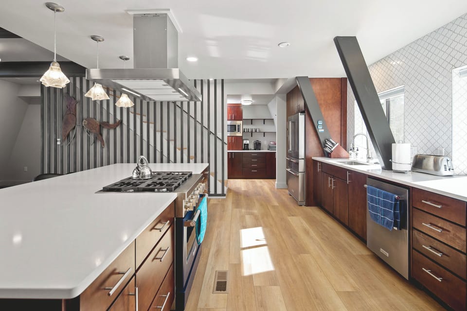 Gourmet kitchen with extra large island gives everyone space to help cook