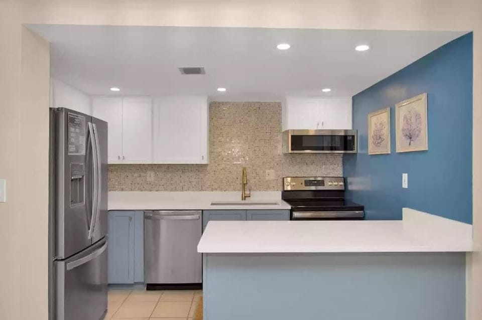 Indulge your culinary skills in our chic, newly renovated kitchen featuring stainless steel appliances.