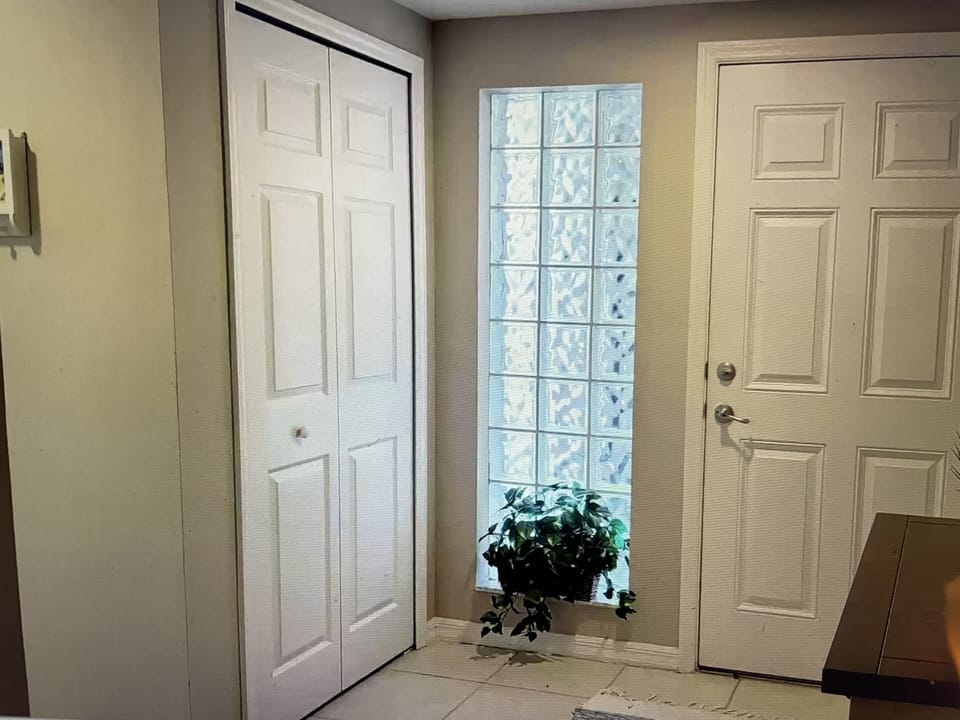 Front closet with beach gear and wagon. 