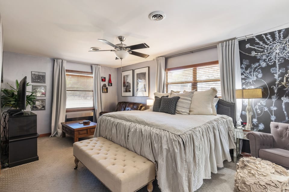 The master bedroom is a peaceful and funky oasis.