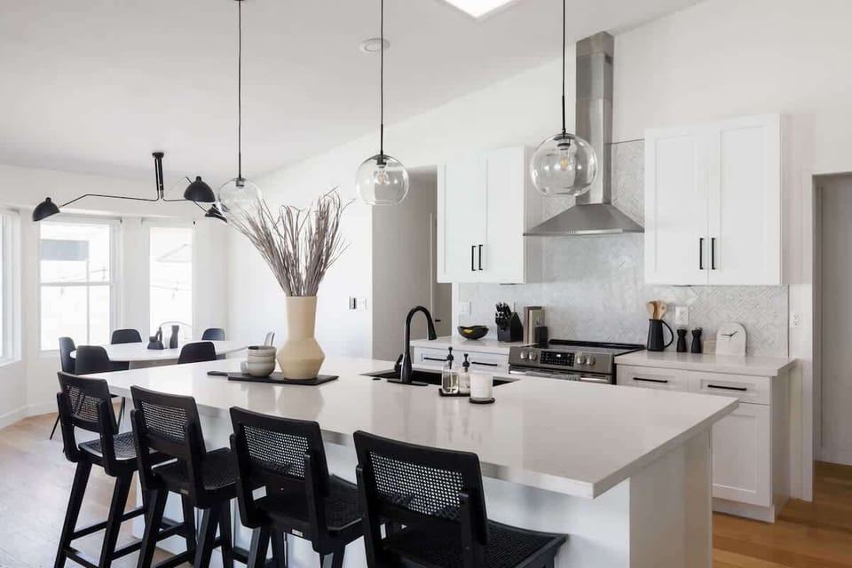 Open concept kitchen with stainless steel appliances, breakfast bar island seating, tons of natural light, and fully stocked with your basic cooking essentials.