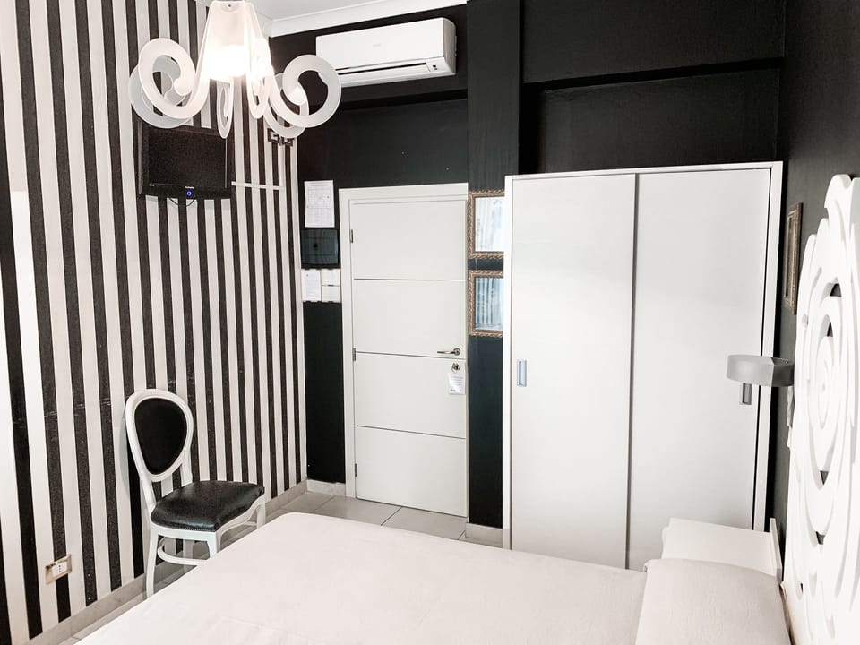 Double Room | Minibar, in-room safe, individually decorated, desk