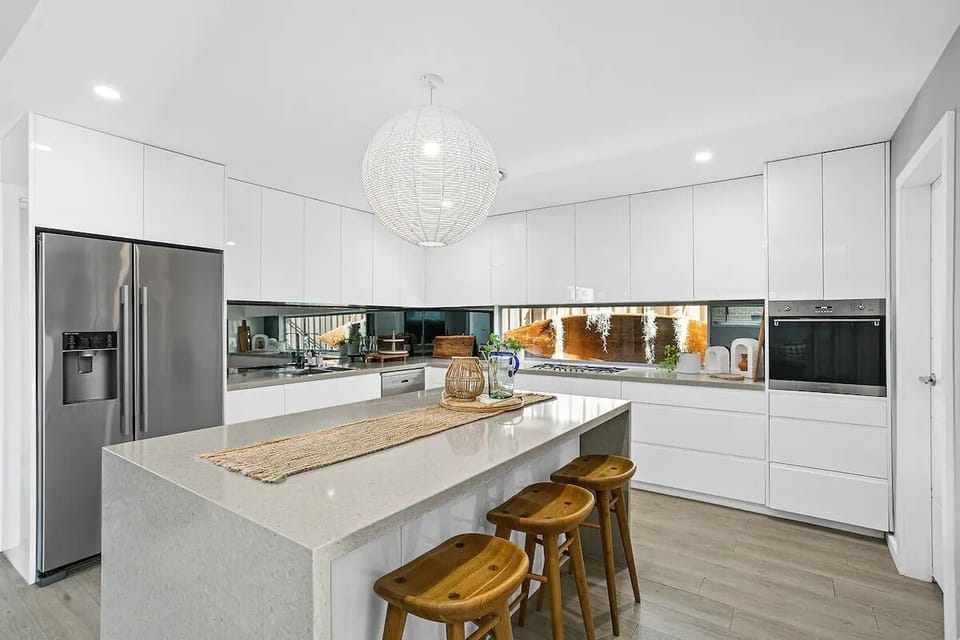 Huge gourmet kitchen with stainless steel appliances & oversized kitchen bench