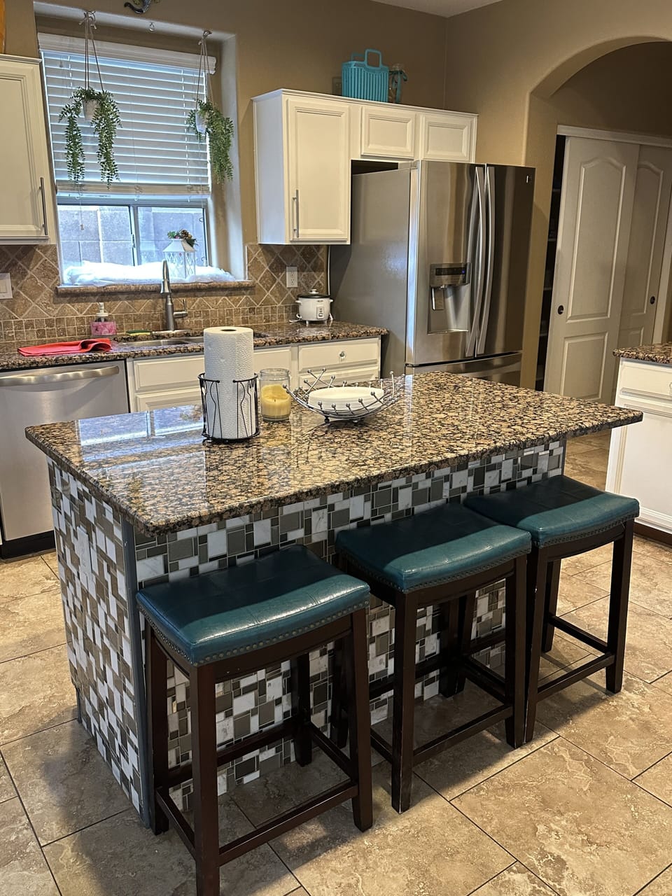 kitchen island with 3 stools