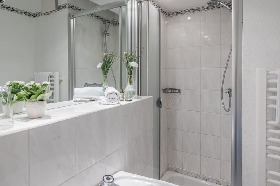 Bathtub, hair dryer, towels