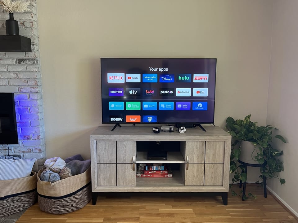 Cozy electric fireplace and a 55 inch smart TV with DIRECTV and free Netflix