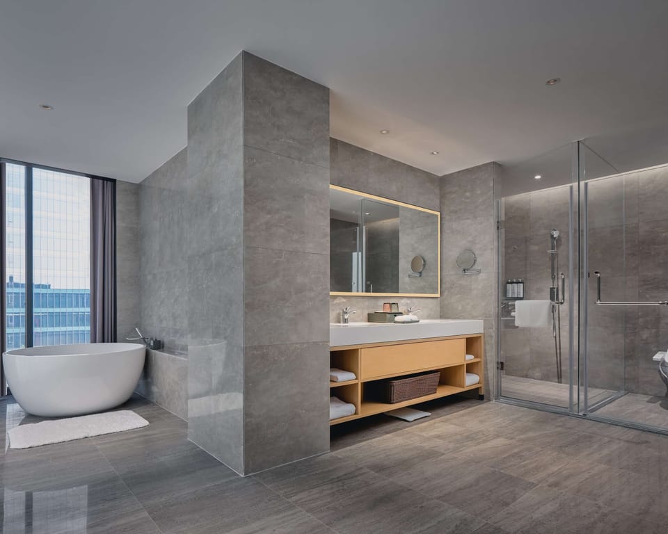 Separate tub and shower, rainfall showerhead, free toiletries