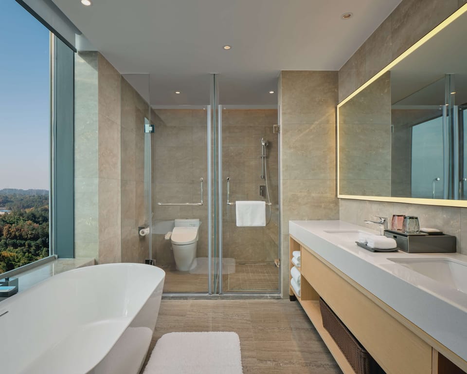 Separate tub and shower, rainfall showerhead, free toiletries