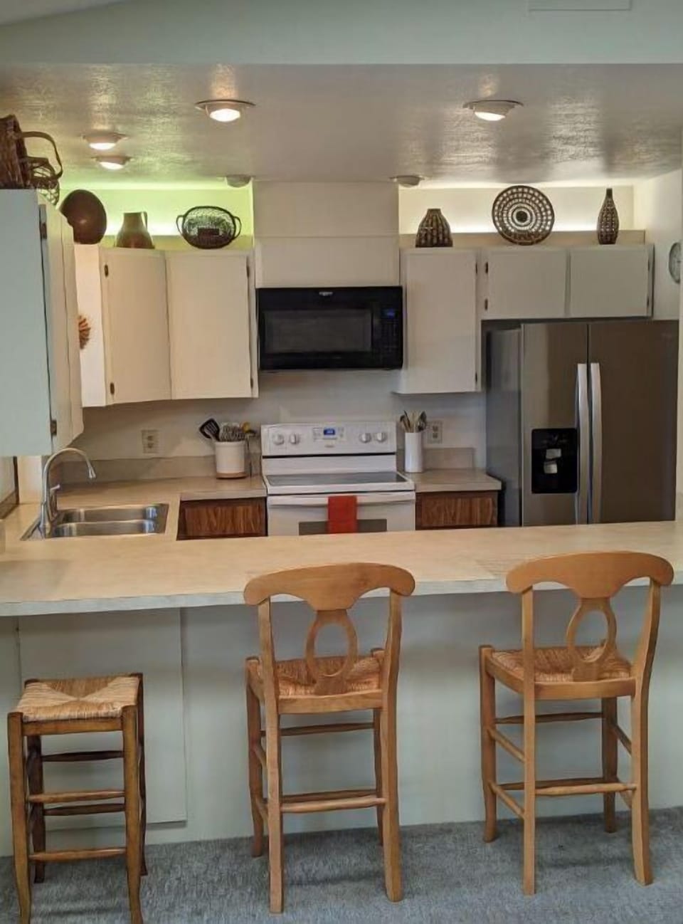 Open kitchen complete with dishwasher, filtered water, ice maker, & Keurig 