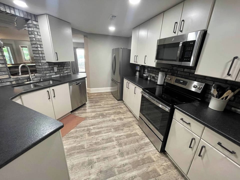 The kitchen is stocked with your standard appliances and utensils 