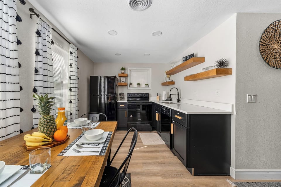 Full kitchen with modern appliances and a spacious dining area for gatherings.