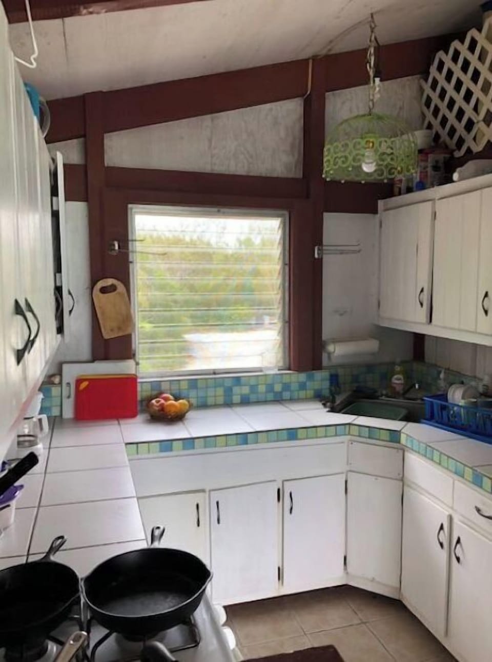 Full kitchen with gas stove/oven, full-size fridge, microwave, dishes, cookware.