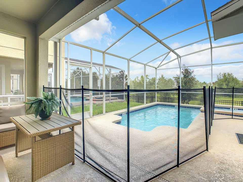 Relax by the private screened pool with scenic views and plenty of sunshine.