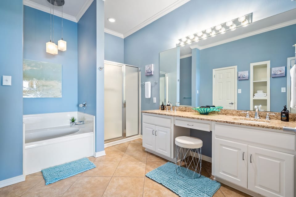 En Suite Master bathroom with whirlpool bathtub, separate walk-in shower, double vanity, walkin closet, and private toilet area.