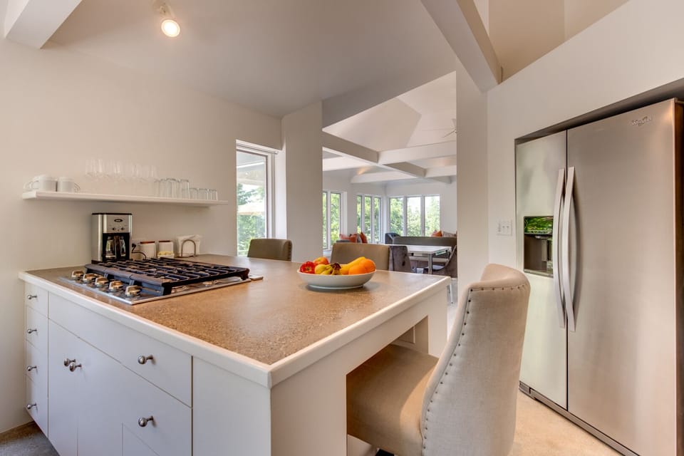Kitchen with ice maker and water dispensing refrigerator 