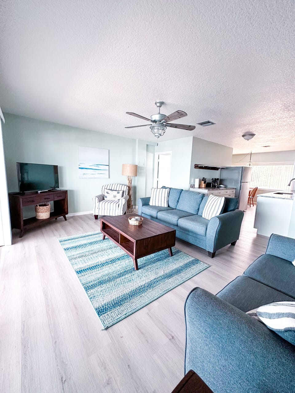 Townhome | Living area | 32-inch flat-screen TV with satellite channels, TV