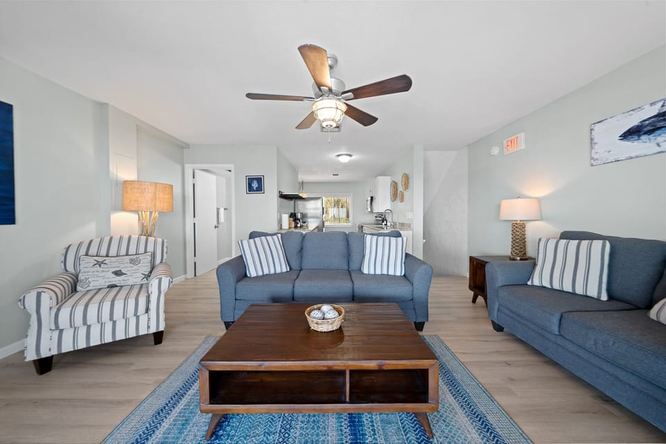 Townhome | Living area | 32-inch flat-screen TV with satellite channels, TV