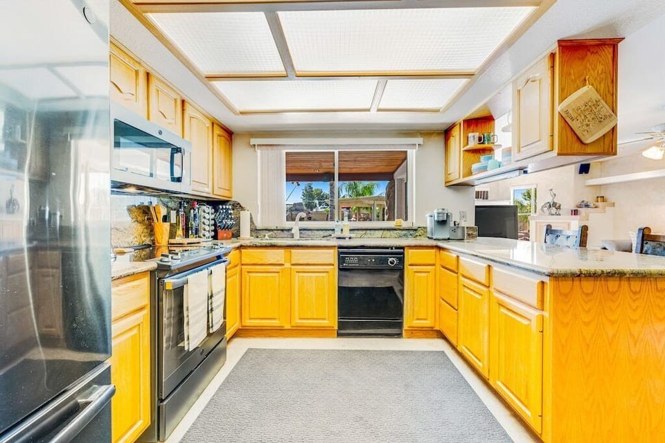 Kitchen - equipped with pots and pans, cooking utensils, keurig, blender