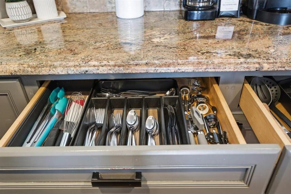 Organized kitchen drawer with essential utensils for cooking ease