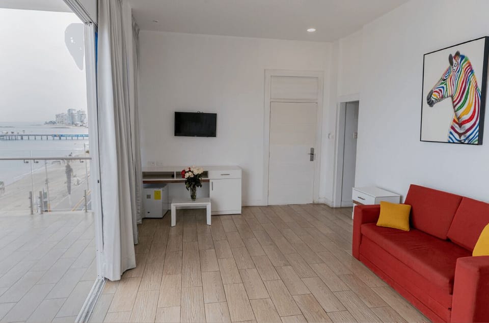 Panoramic Suite, 1 King Bed with Sofa bed, Beach View | Living area | 32-inch flat-screen TV with digital channels, TV