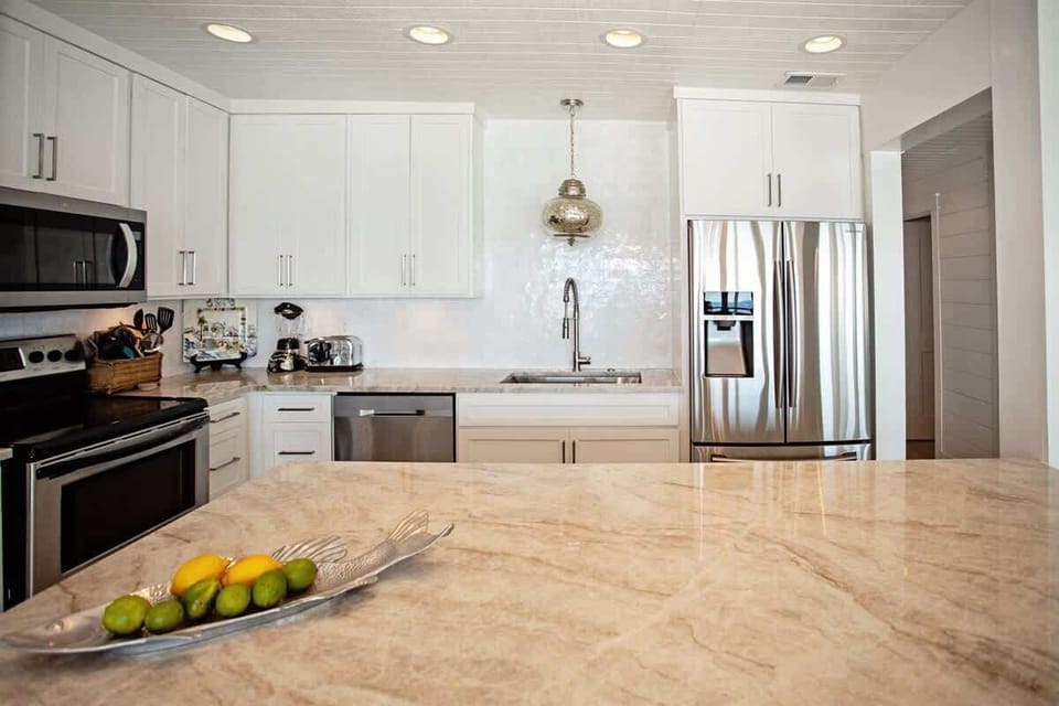 - Cook, laugh, and hang out in this fresh and inviting kitchen space that keeps everything close - Easy flow from counter to stove makes whipping up meals feel like part of the fun - Bright light, neat touches, and room for good times