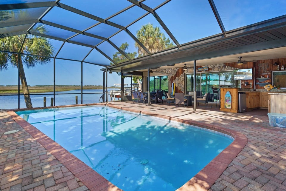 Saltwater screened pool- pool is able to be heated for a fee. 