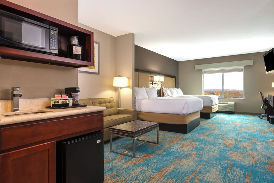 Suite, 2 Queen Beds (Extra Floor Space) | Desk, laptop workspace, iron/ironing board, free cribs/infant beds