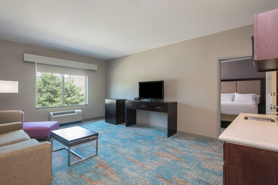 Suite, 2 Queen Beds (Extra Floor Space) | Desk, laptop workspace, iron/ironing board, free cribs/infant beds
