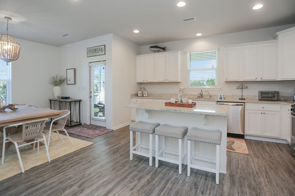 Kitchen with Bar Seating & Dining Area