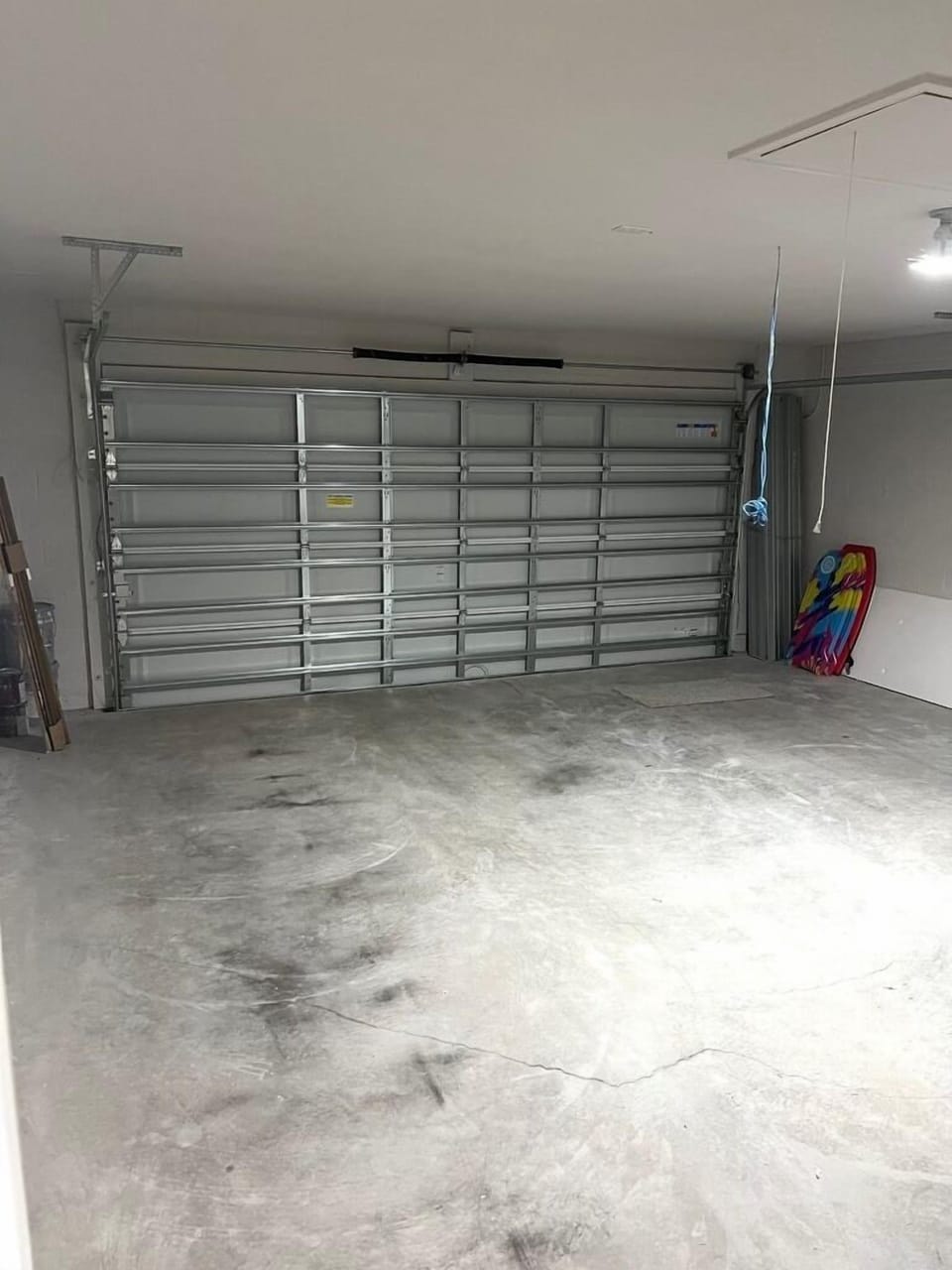 Garage - Manual Door - Boogie Boards - Beach Chairs - Floor Fan