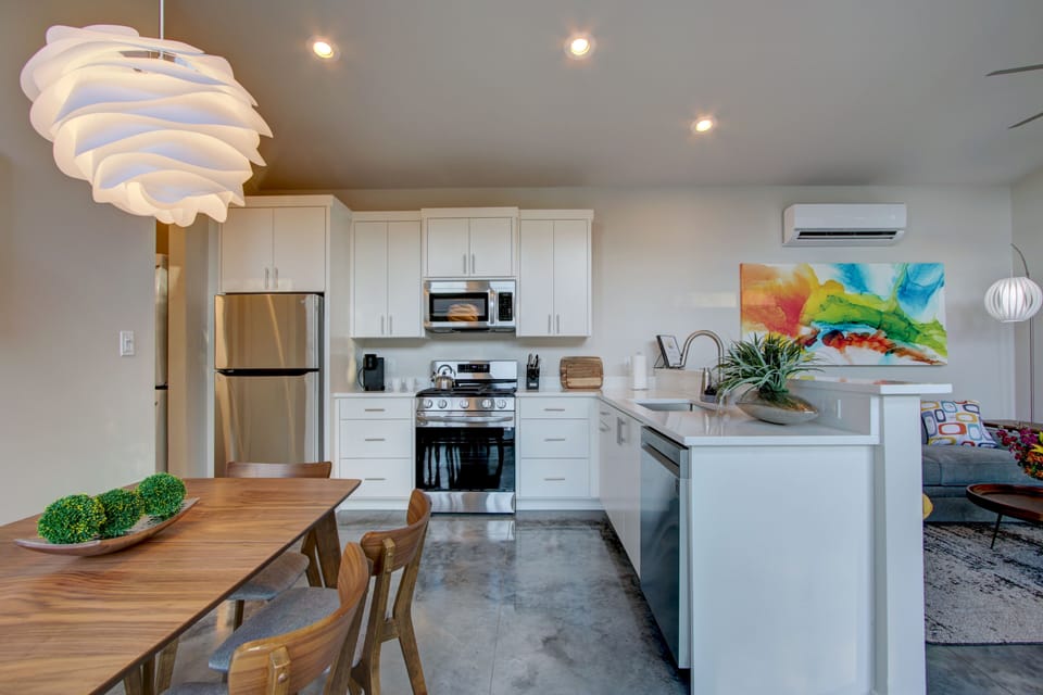 Stainless kitchen with fridge & icemaker; stove/oven, microwave & dishwasher.
