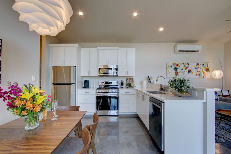 Stainless kitchen with fridge & icemaker; stove/oven, microwave & dishwasher.