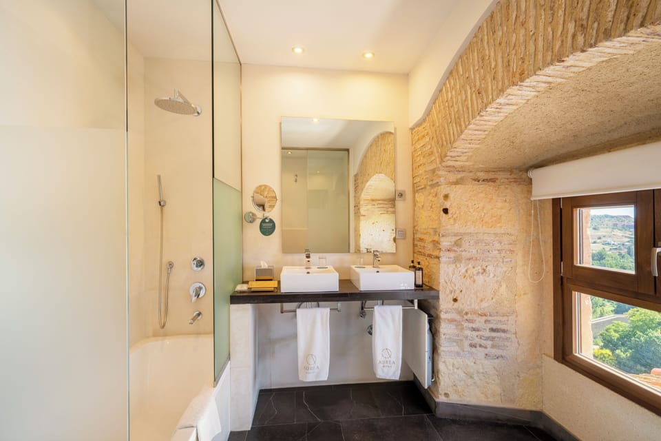 Eco-friendly toiletries, hair dryer, slippers, towels