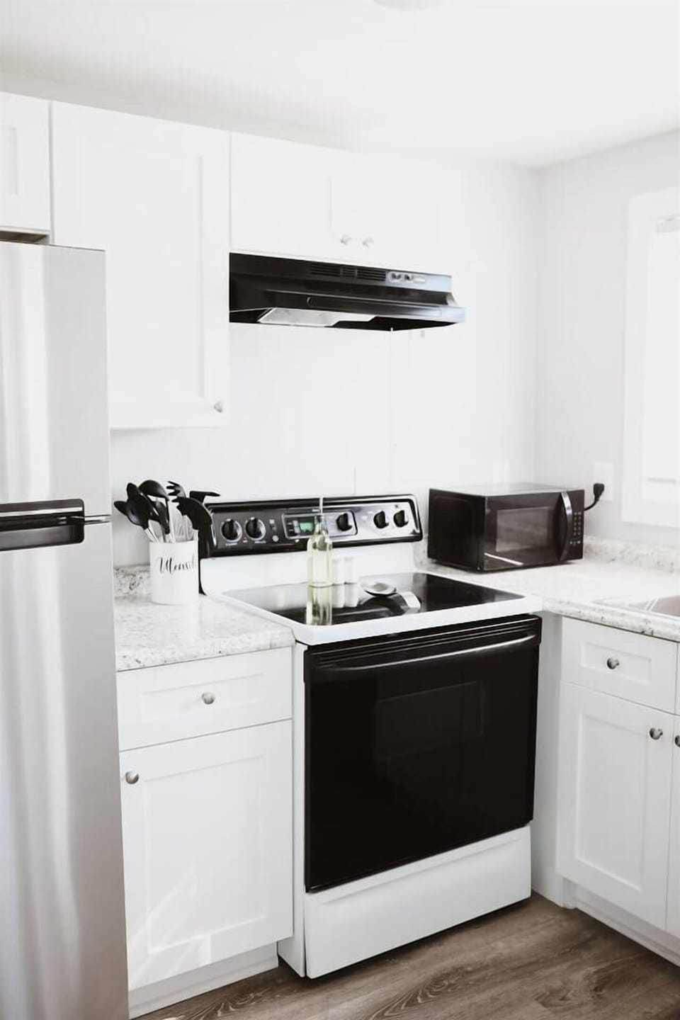 Well stocked kitchen with amenities to get your stay started (paper towels, hand soap, dish soap, sponge, and more)