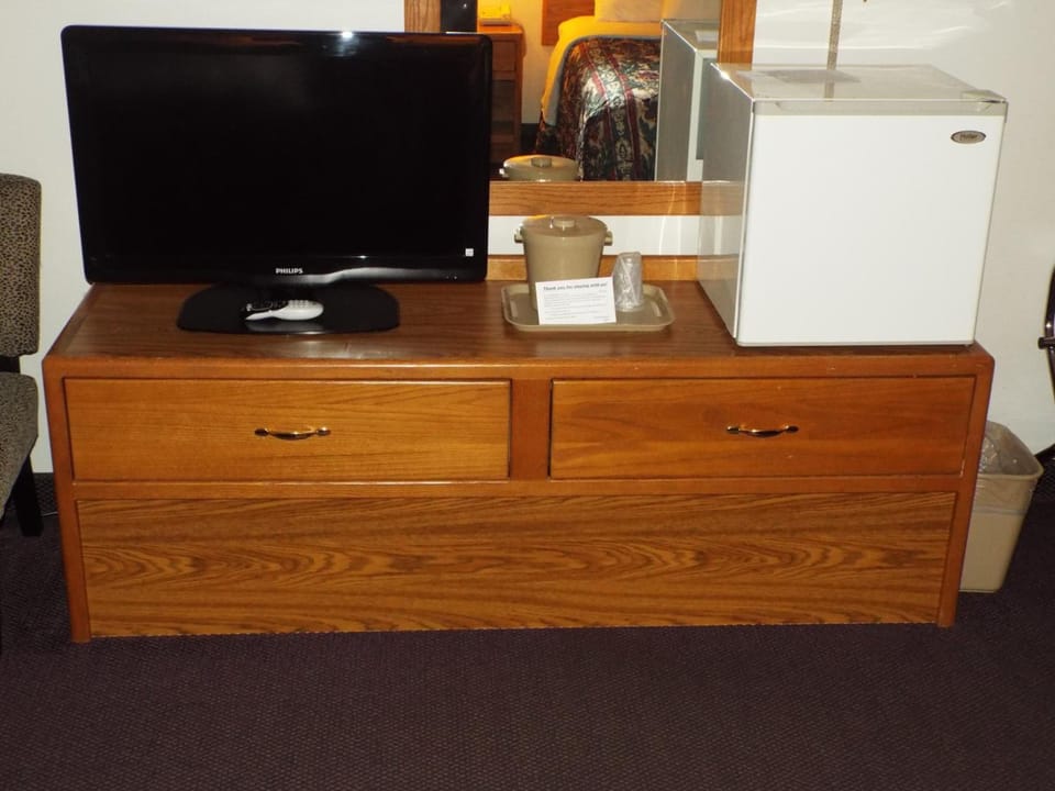 Desk, laptop workspace, blackout drapes, iron/ironing board