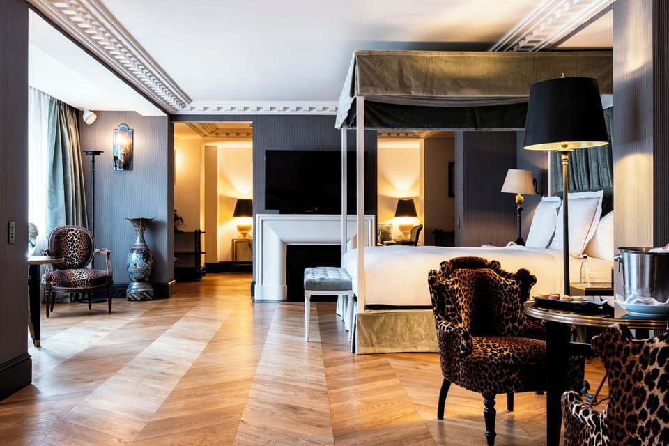 Deluxe Suite, 1 King Bed | Premium bedding, minibar, in-room safe, individually decorated