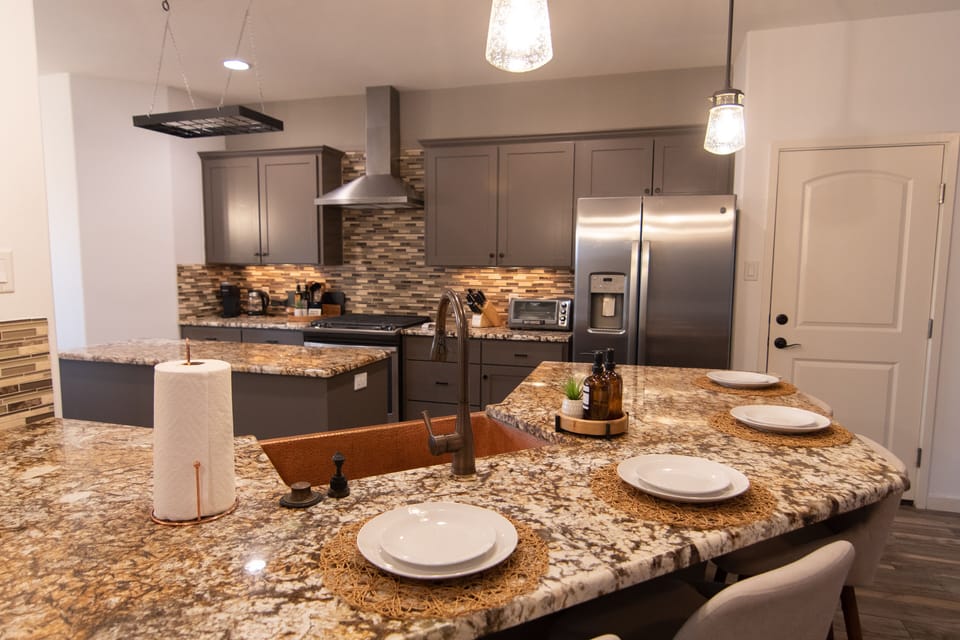 Fully-equipped with stainless steel appliances, plus seating for 4 at bar.